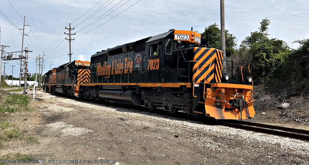 WE 7023 now leads the power back to the yard.
